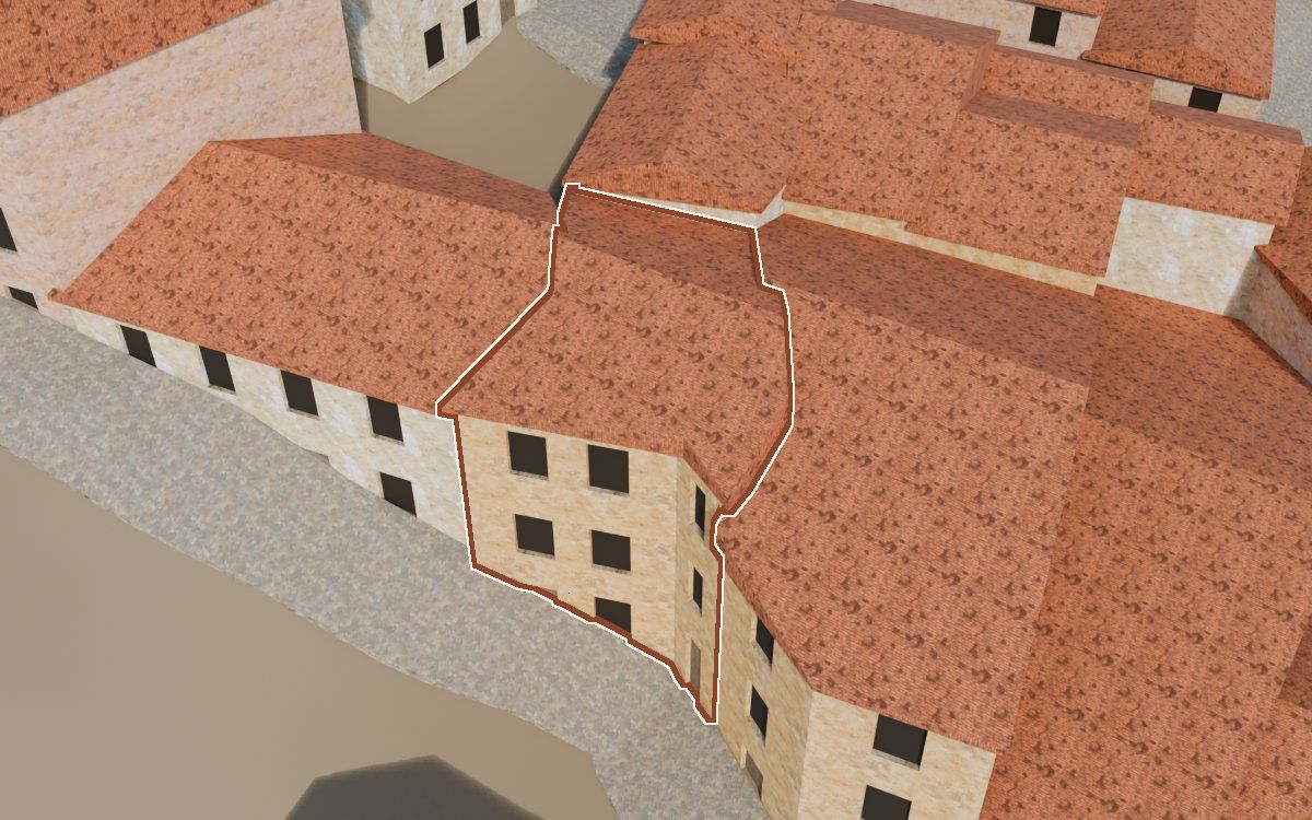 Manzana 41, n.º 17 en la reconstrucción 3D, vista desde el lado en que mejor se ve, con su contorno marcado en teja entre las casas de alrededor